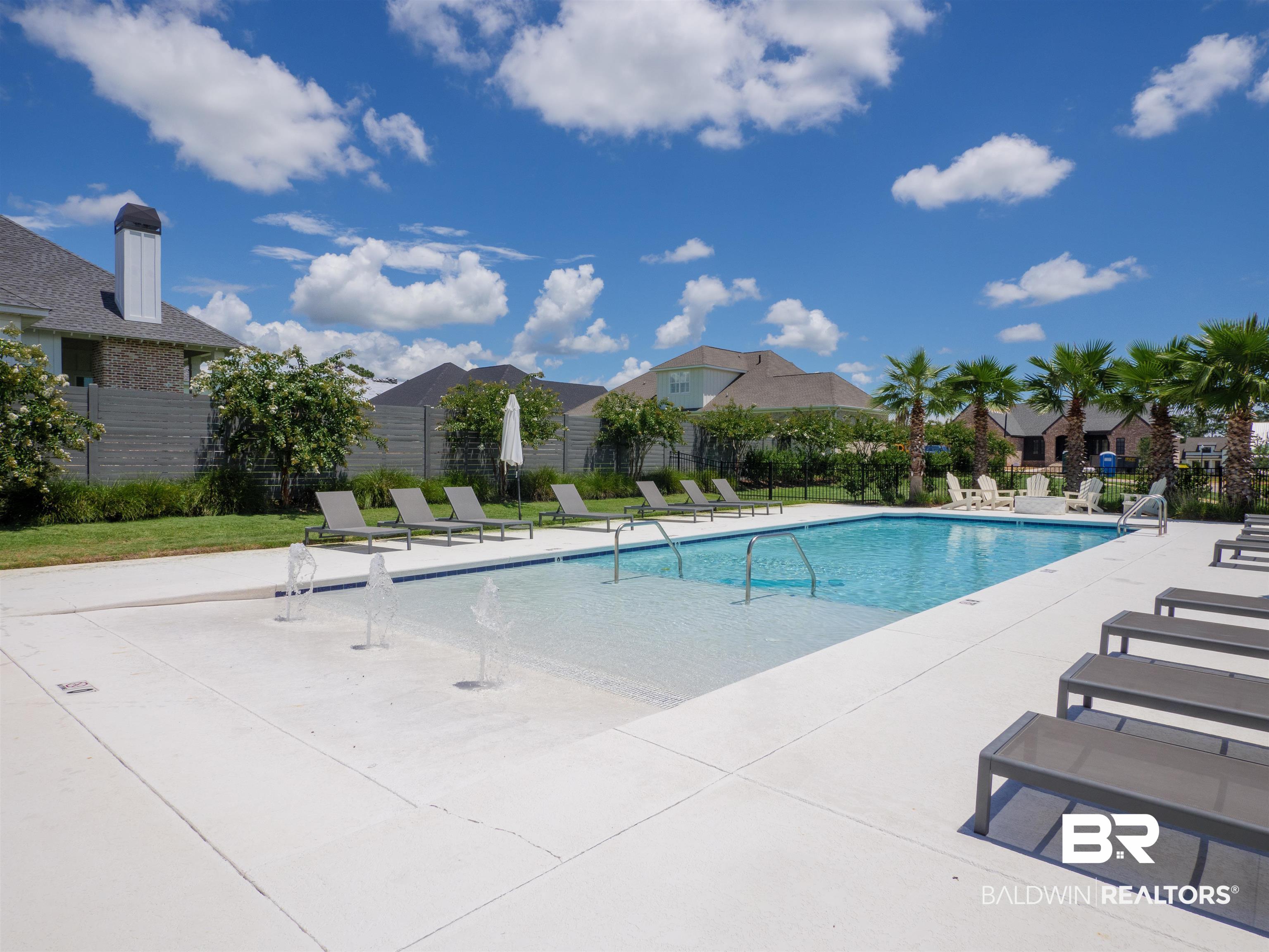10970 Turin Avenue Fairhope, AL 36532 - Photo 56 of 61 Community pool with a patio area and fence
