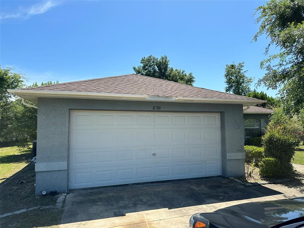 8799 Southwest 66th Avenue Ocala, FL 34476 - Photo 1 of 28 a backyard of a house