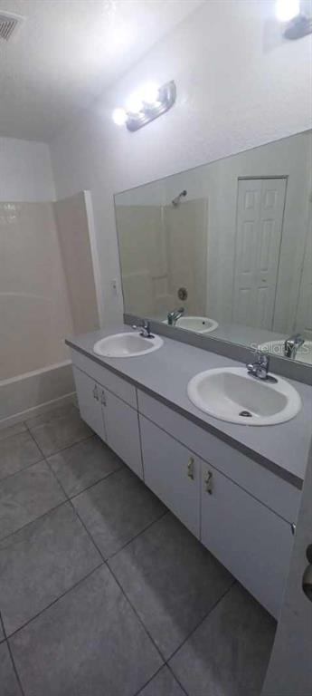 8799 Southwest 66th Avenue Ocala, FL 34476 - Photo 17 of 28 a bathroom with a sink and a mirror
