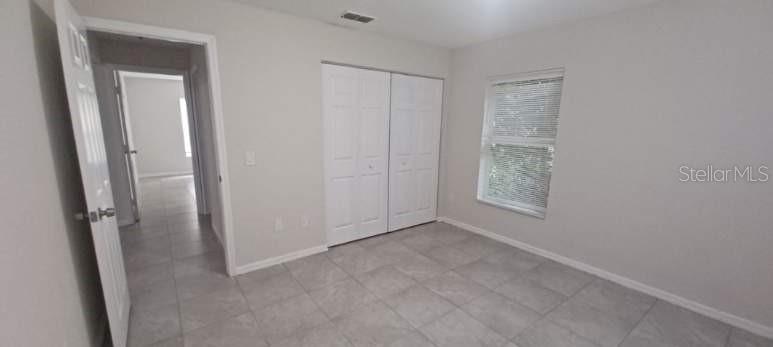 8799 Southwest 66th Avenue Ocala, FL 34476 - Photo 19 of 28 an empty room with windows