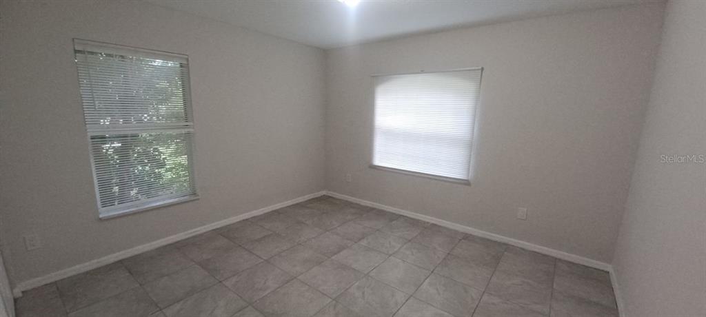 8799 Southwest 66th Avenue Ocala, FL 34476 - Photo 20 of 28 an empty room with windows