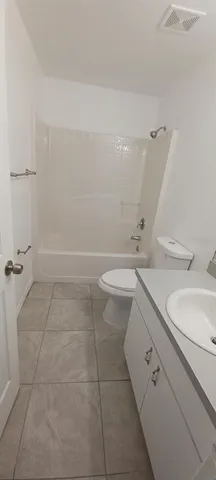 a bathroom with a bathtub and shower