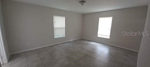 8799 Southwest 66th Avenue Ocala, FL 34476 - Photo 7 of 28 an empty room with a window