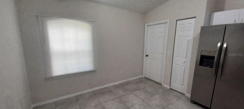 8799 Southwest 66th Avenue Ocala, FL 34476 - Photo 9 of 28 a view of an empty room with a window