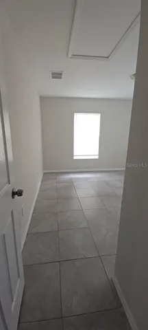 a view of hallway with a window