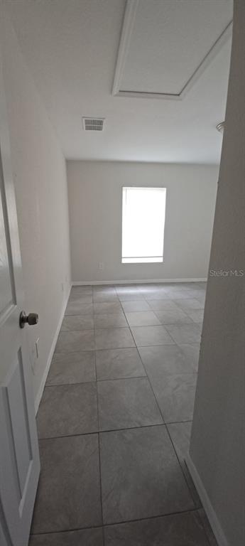8799 Southwest 66th Avenue Ocala, FL 34476 - Photo 10 of 28 a view of an empty room and a window