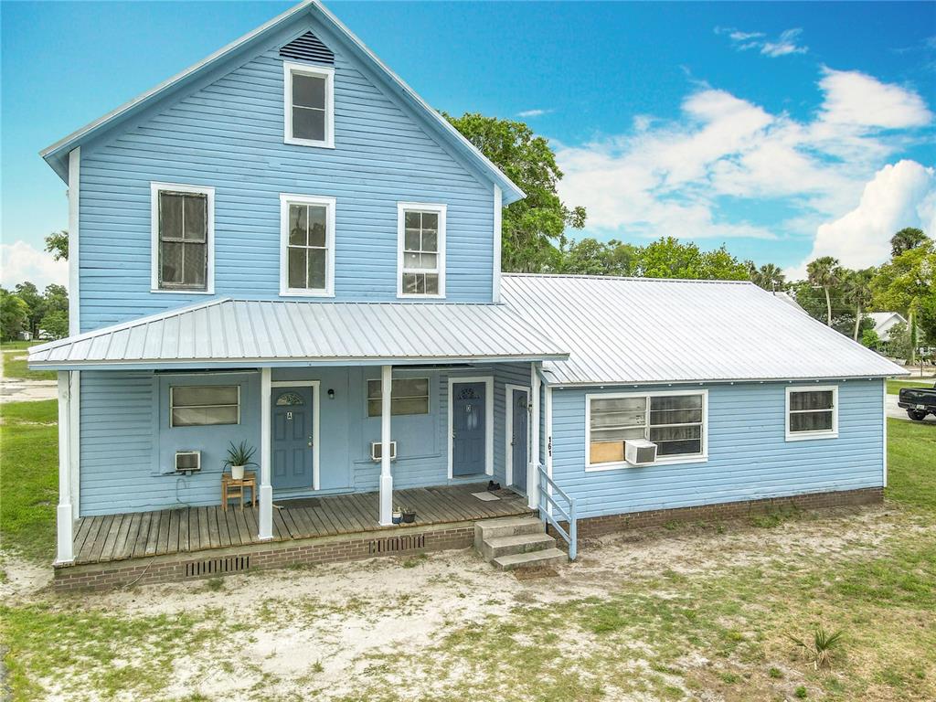 161 West 2nd Avenue Pierson, FL 32180 - Photo 14 of 32 a house with trees in the background
