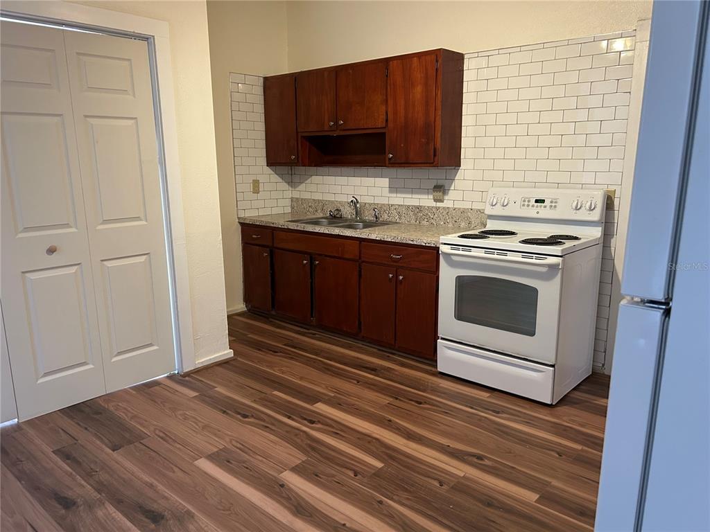 161 West 2nd Avenue Pierson, FL 32180 - Photo 3 of 31 a kitchen with a stove and a microwave