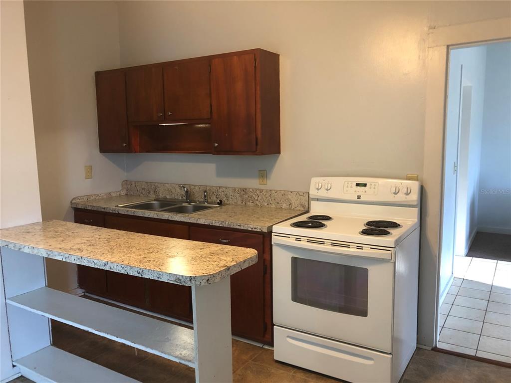 161 West 2nd Avenue Pierson, FL 32180 - Photo 4 of 32 a kitchen with a stove and a microwave