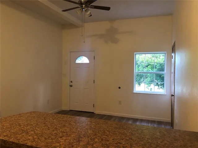 a view of an empty room and window