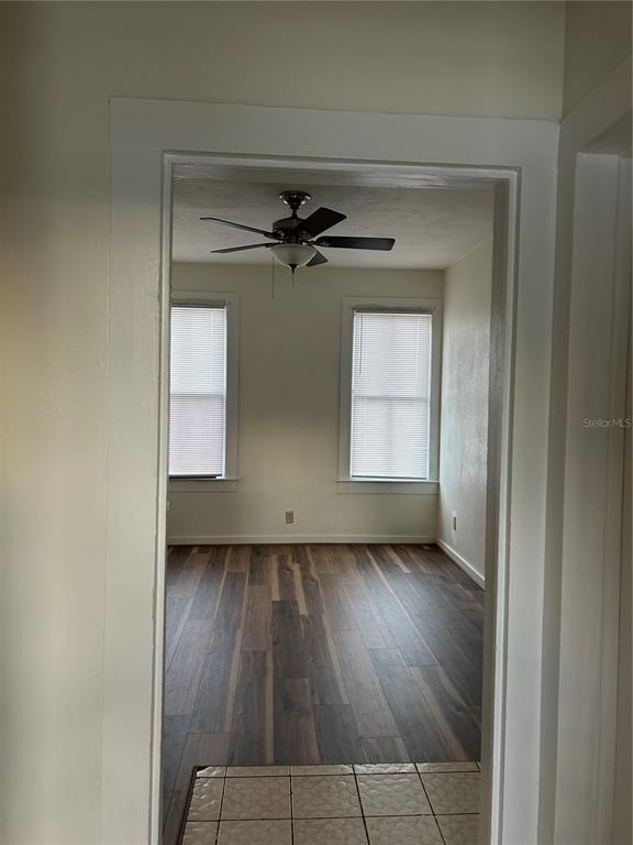 161 West 2nd Avenue Pierson, FL 32180 - Photo 6 of 31 an empty room with a window and a ceiling fan