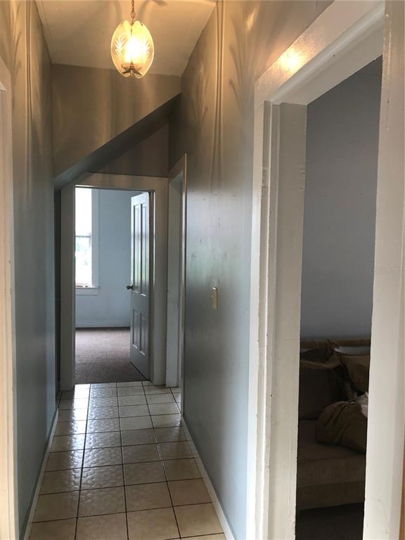 161 West 2nd Avenue Pierson, FL 32180 - Photo 10 of 31 a view of a hallway with a livingroom and a bathroom