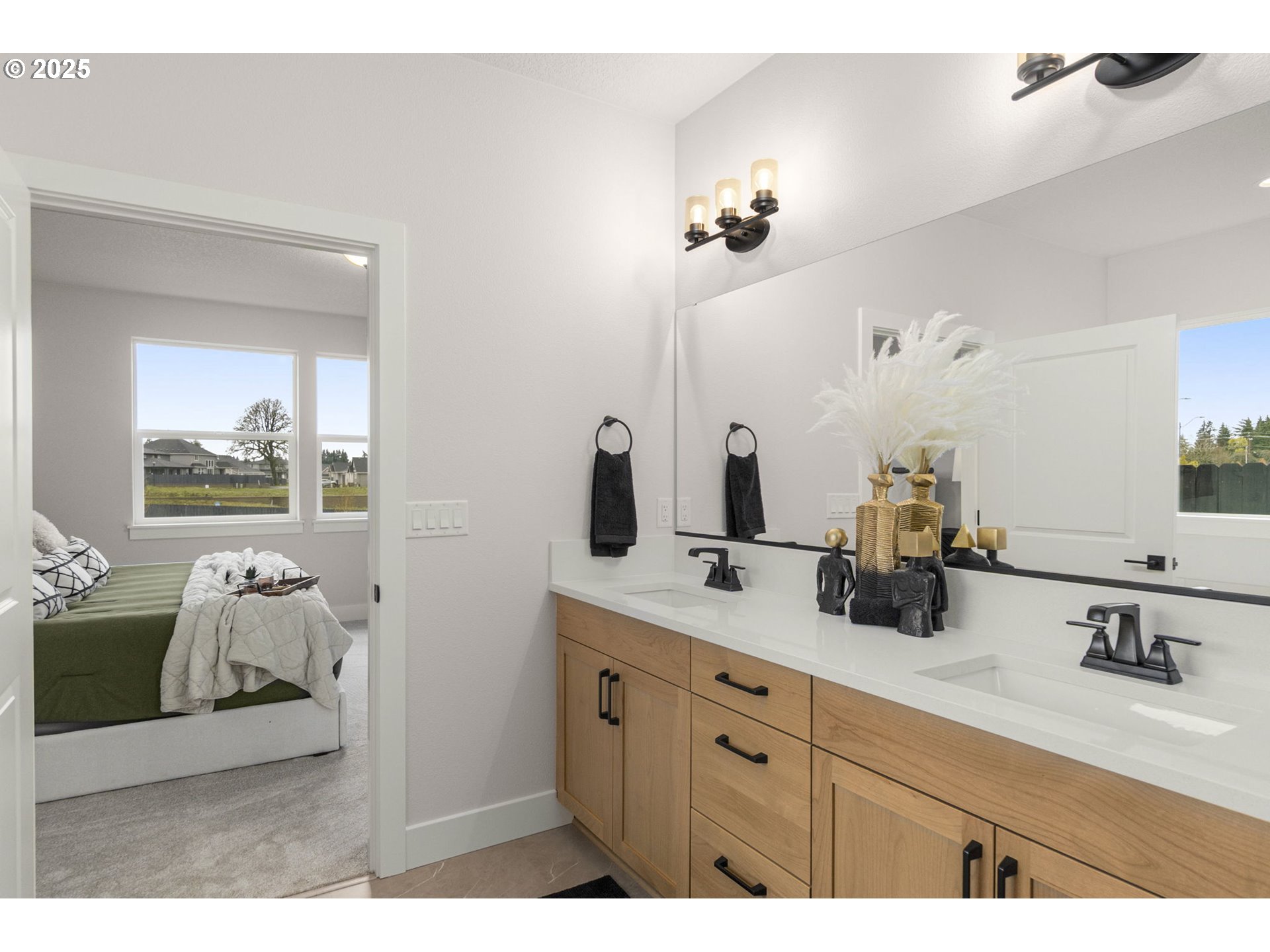 4117 South 14th Way Ridgefield, WA 98642 - Photo 10 of 20 a bathroom with a sink double vanity granite and a mirror