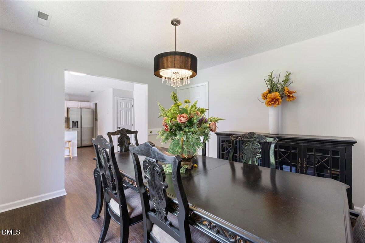 4708 River Boat Landing Court Raleigh, NC 27604 - Photo 15 of 61 a dining room with furniture and window