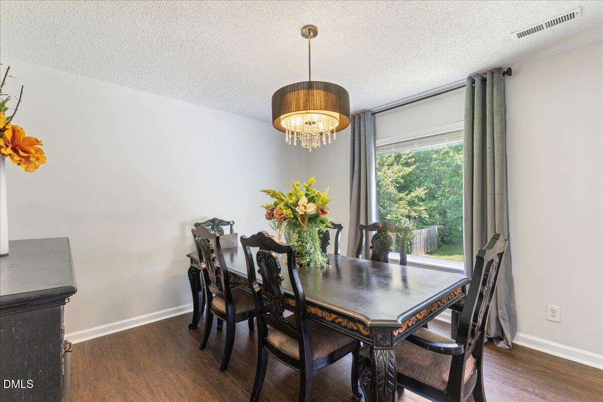 4708 River Boat Landing Court Raleigh, NC 27604 - Photo 17 of 61 a dining room with furniture and window