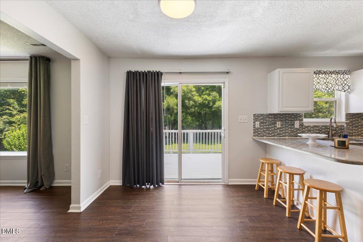 4708 River Boat Landing Court Raleigh, NC 27604 - Photo 19 of 61 an empty room with wooden floor and a window