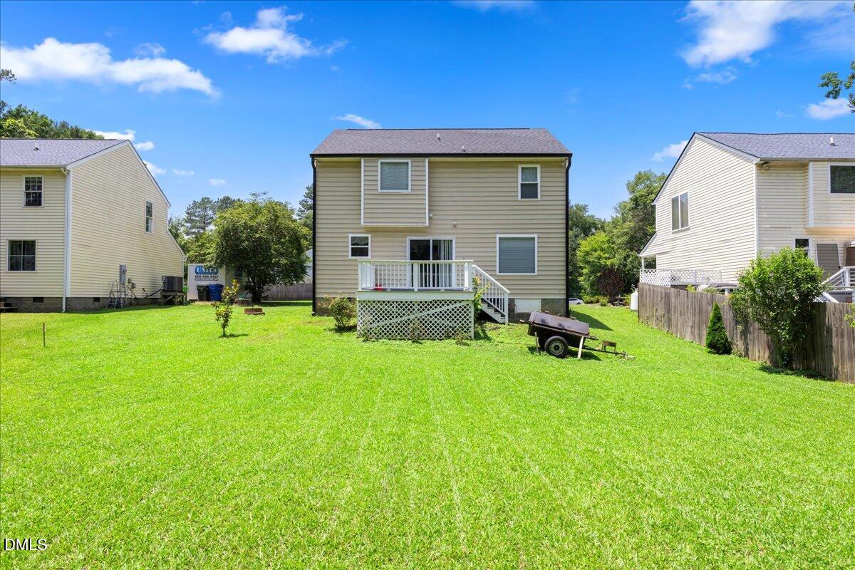 4708 River Boat Landing Court Raleigh, NC 27604 - Photo 43 of 61 a view of a house with backyard and a tree