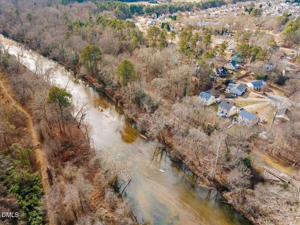 4708 River Boat Landing Court Raleigh, NC 27604 - Photo 44 of 61 a view of a yard with a tree