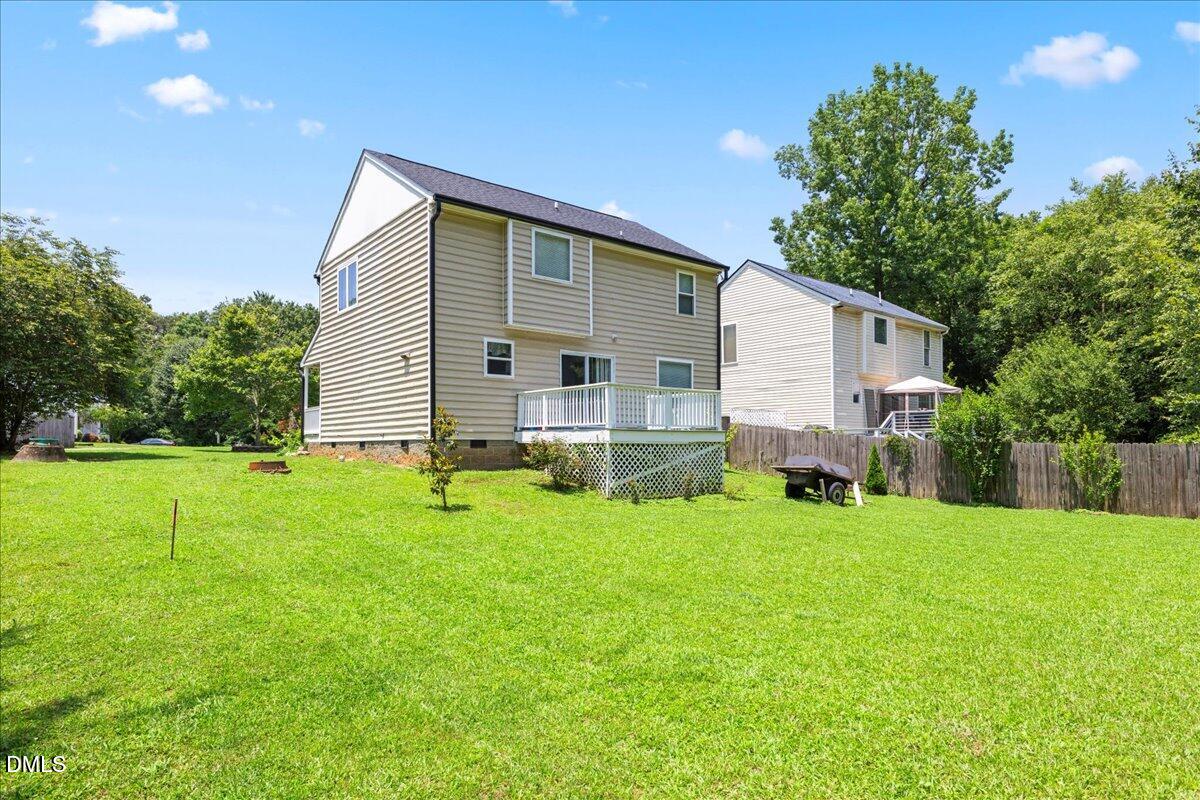 4708 River Boat Landing Court Raleigh, NC 27604 - Photo 45 of 61 a backyard of a house with table and chairs