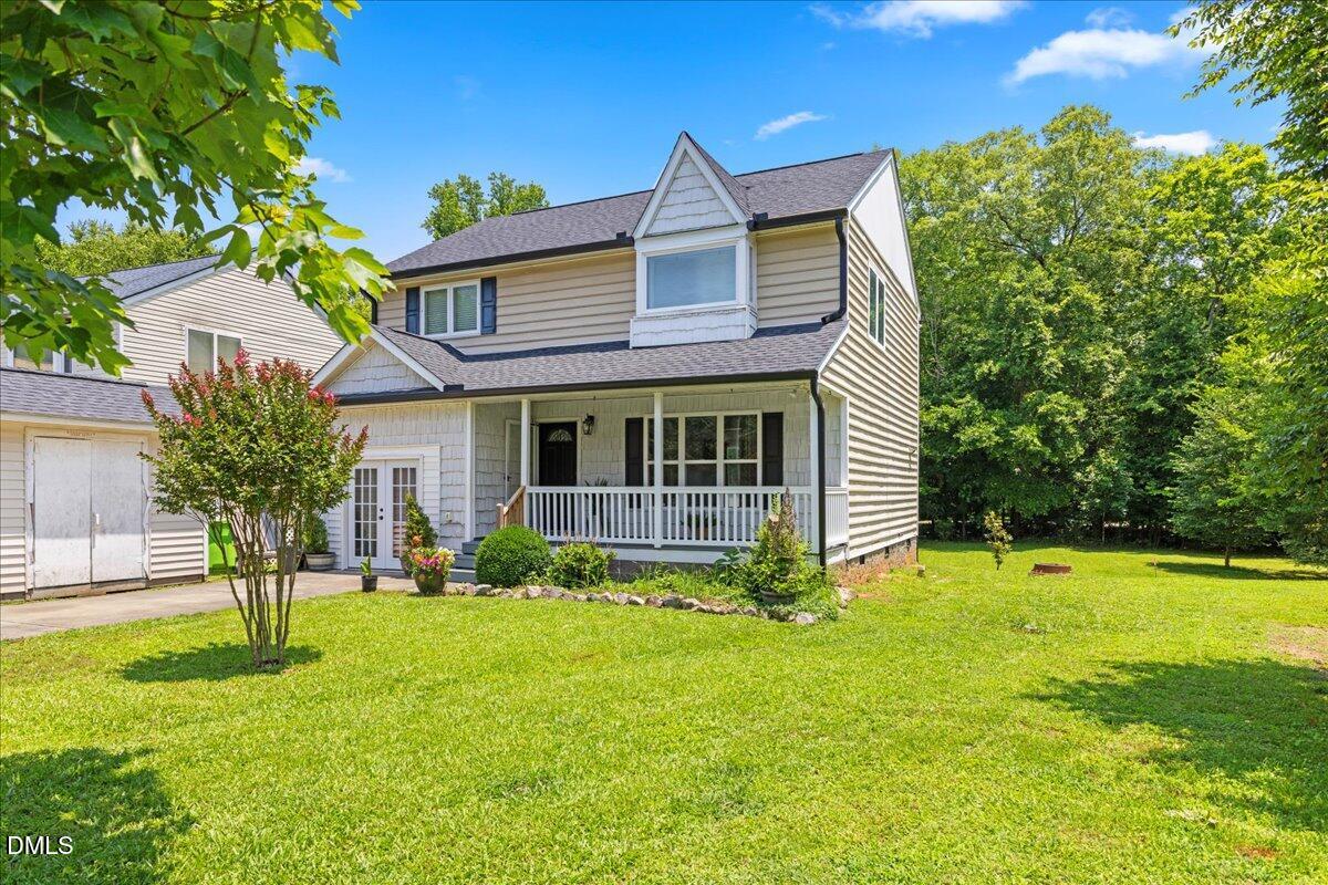4708 River Boat Landing Court Raleigh, NC 27604 - Photo 4 of 61 a view of a house with a yard and a tree