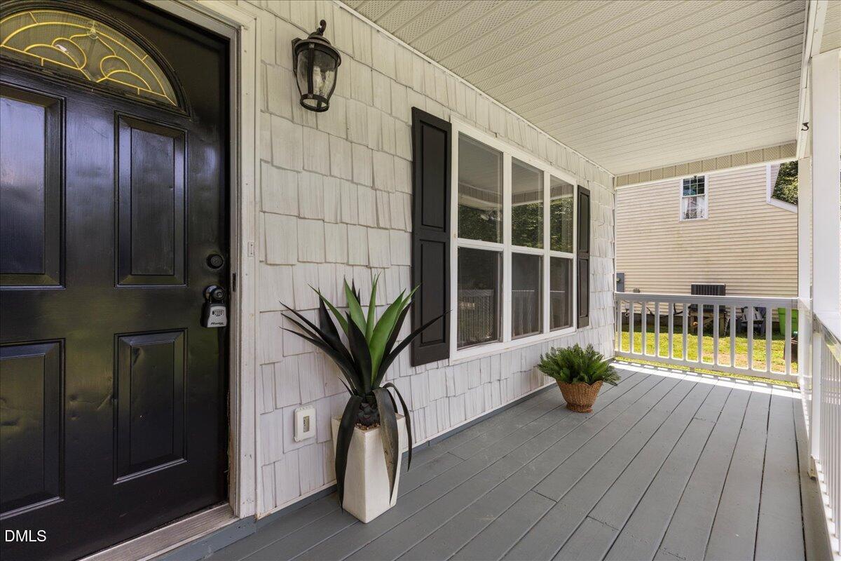 4708 River Boat Landing Court Raleigh, NC 27604 - Photo 5 of 61 a view of balcony with potted plants and wooden floor