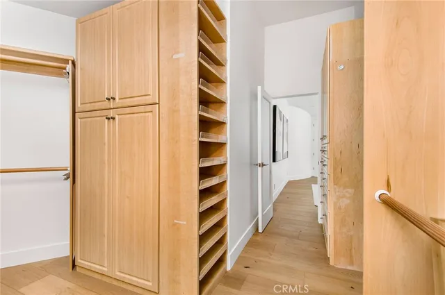 a spacious bedroom with a bed and a couch