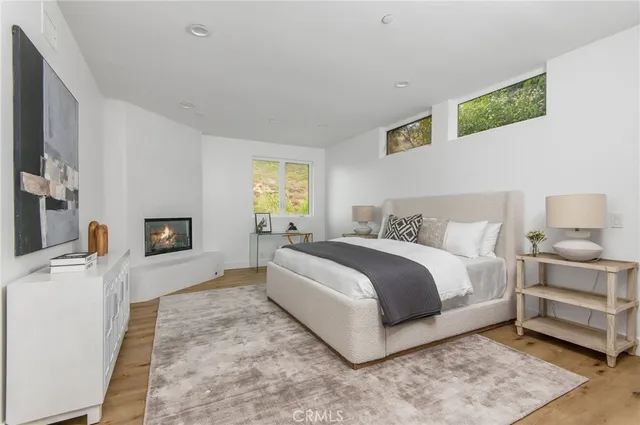 a bathroom with a double vanity sink mirror and bathtub