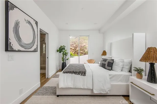 a bathroom with a granite countertop sink double and mirror