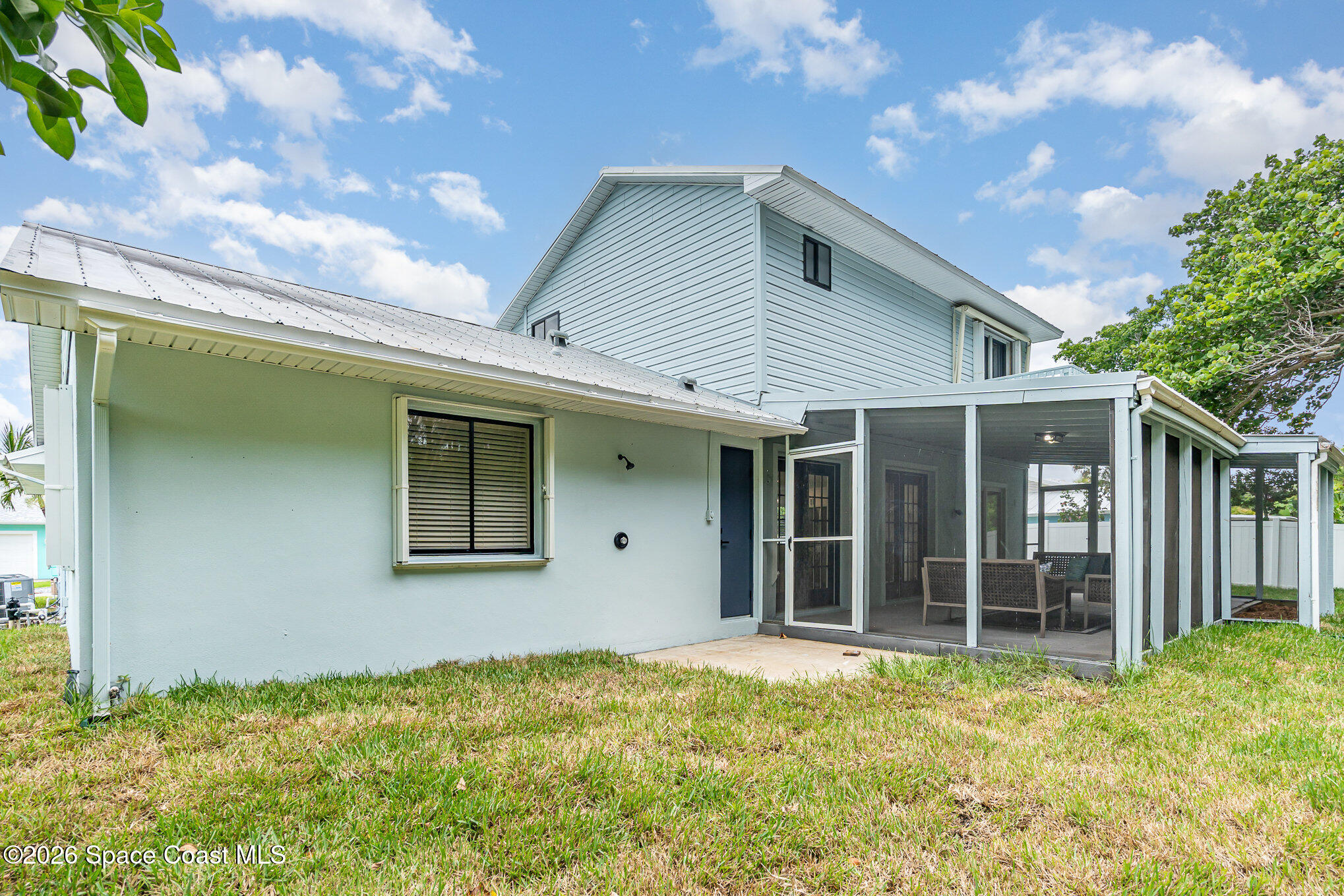 362 Nikomas Way Melbourne Beach, FL 32951 - Photo 25 of 32 a house with yard in front of it