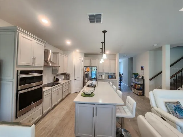 a kitchen with counter space cabinets and appliances