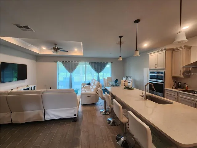 a large room with a large window and furniture