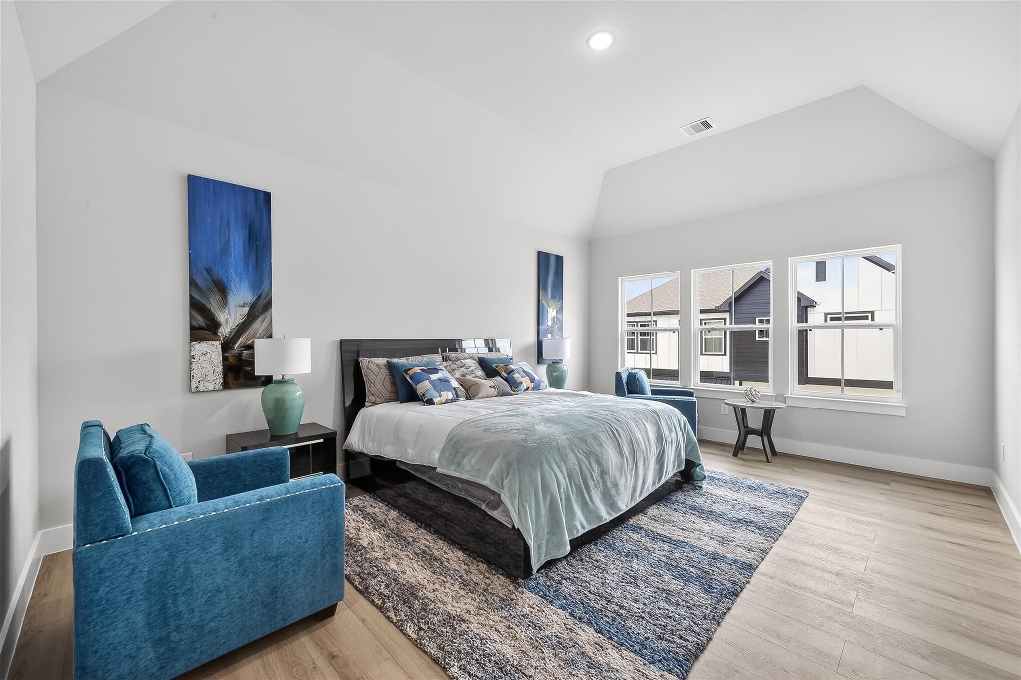 6702 Metro Boulevard, Unit 2 Houston, TX 77083 - Photo 22 of 39 a bedroom with a large bed and a couch