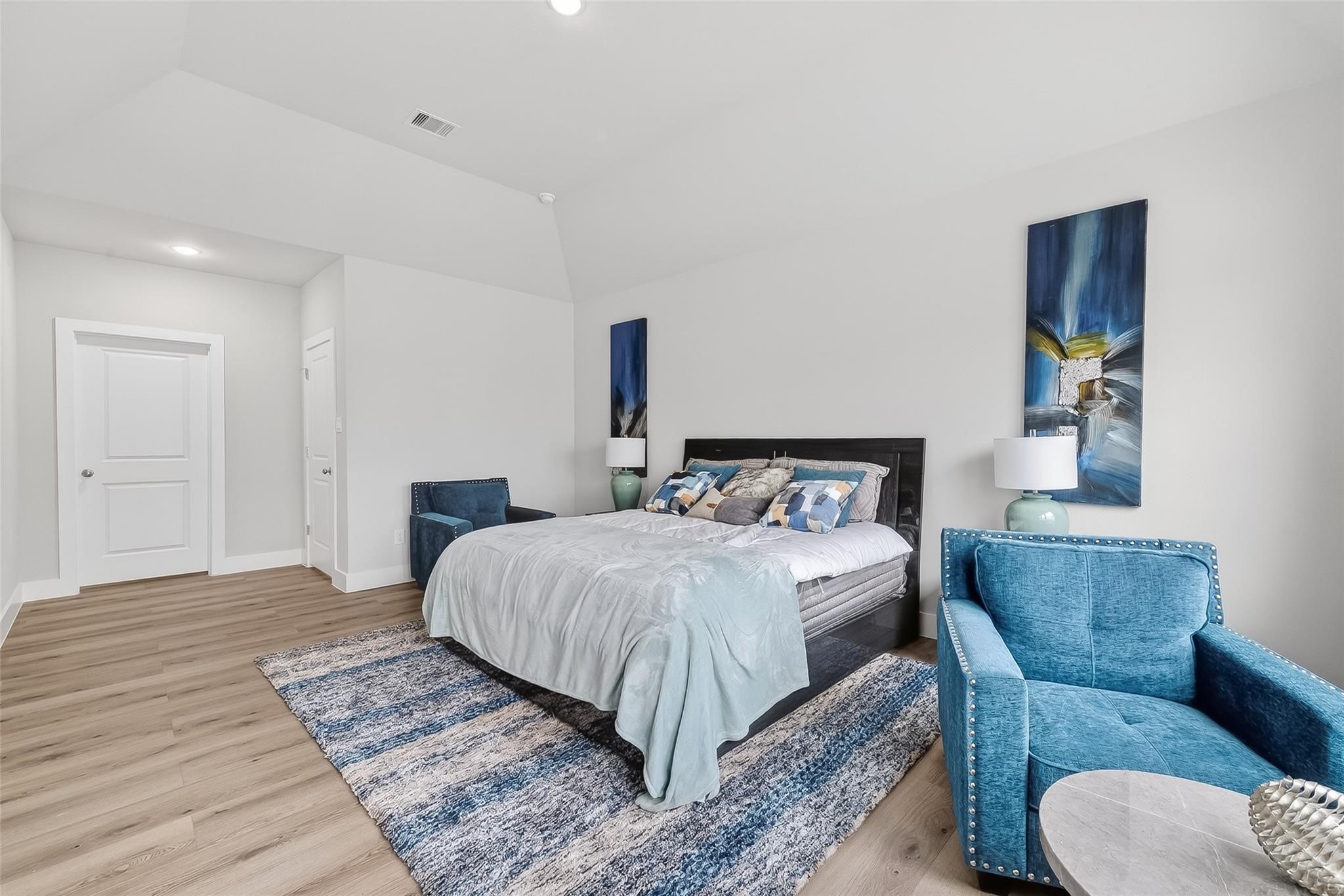 6702 Metro Boulevard, Unit 2 Houston, TX 77083 - Photo 23 of 39 a bedroom with a bed a couch and a dresser