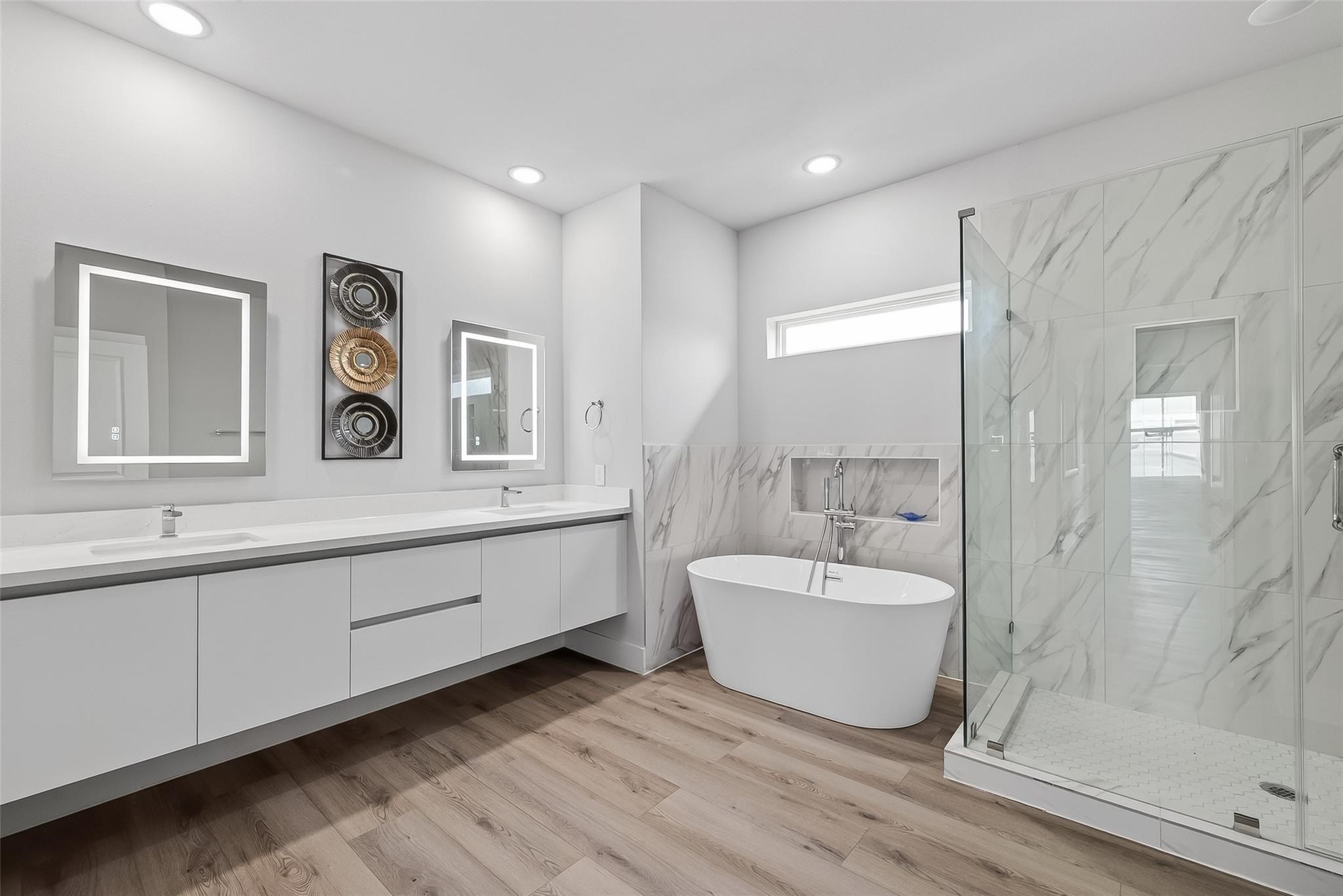 6702 Metro Boulevard, Unit 2 Houston, TX 77083 - Photo 24 of 39 a bathroom with a sink and mirror