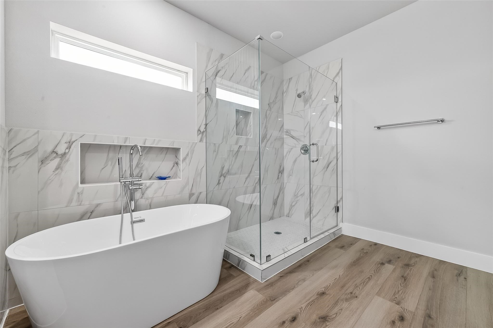6702 Metro Boulevard, Unit 2 Houston, TX 77083 - Photo 25 of 39 a bathroom with a bathtub and a shower