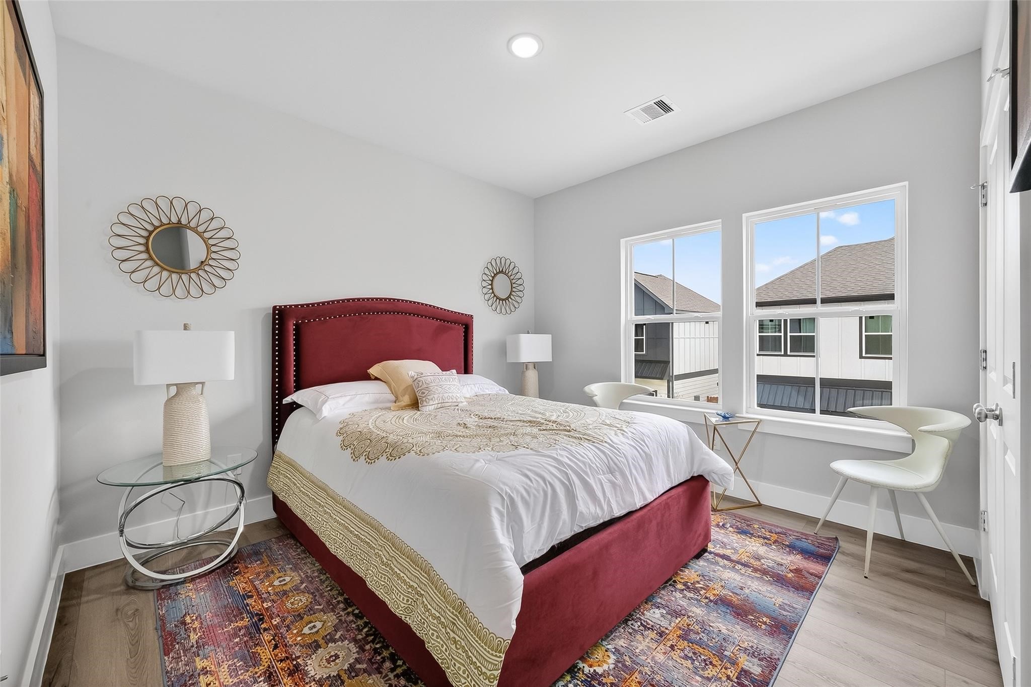 6702 Metro Boulevard, Unit 2 Houston, TX 77083 - Photo 27 of 39 a bedroom with a bed and wooden floor