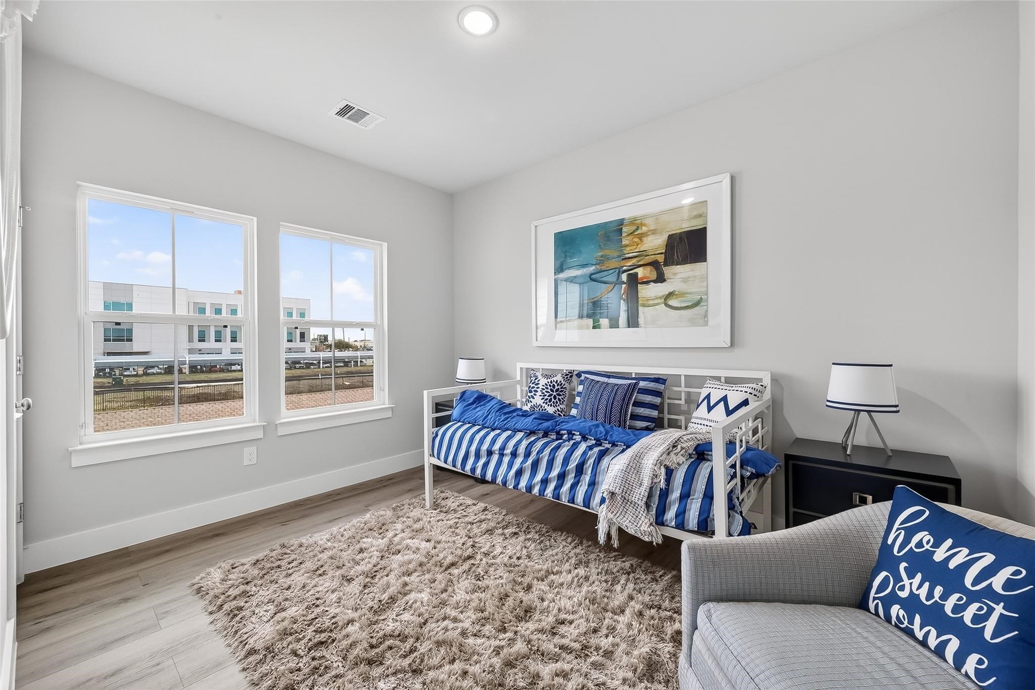 6702 Metro Boulevard, Unit 2 Houston, TX 77083 - Photo 29 of 39 a living room with furniture and a rug