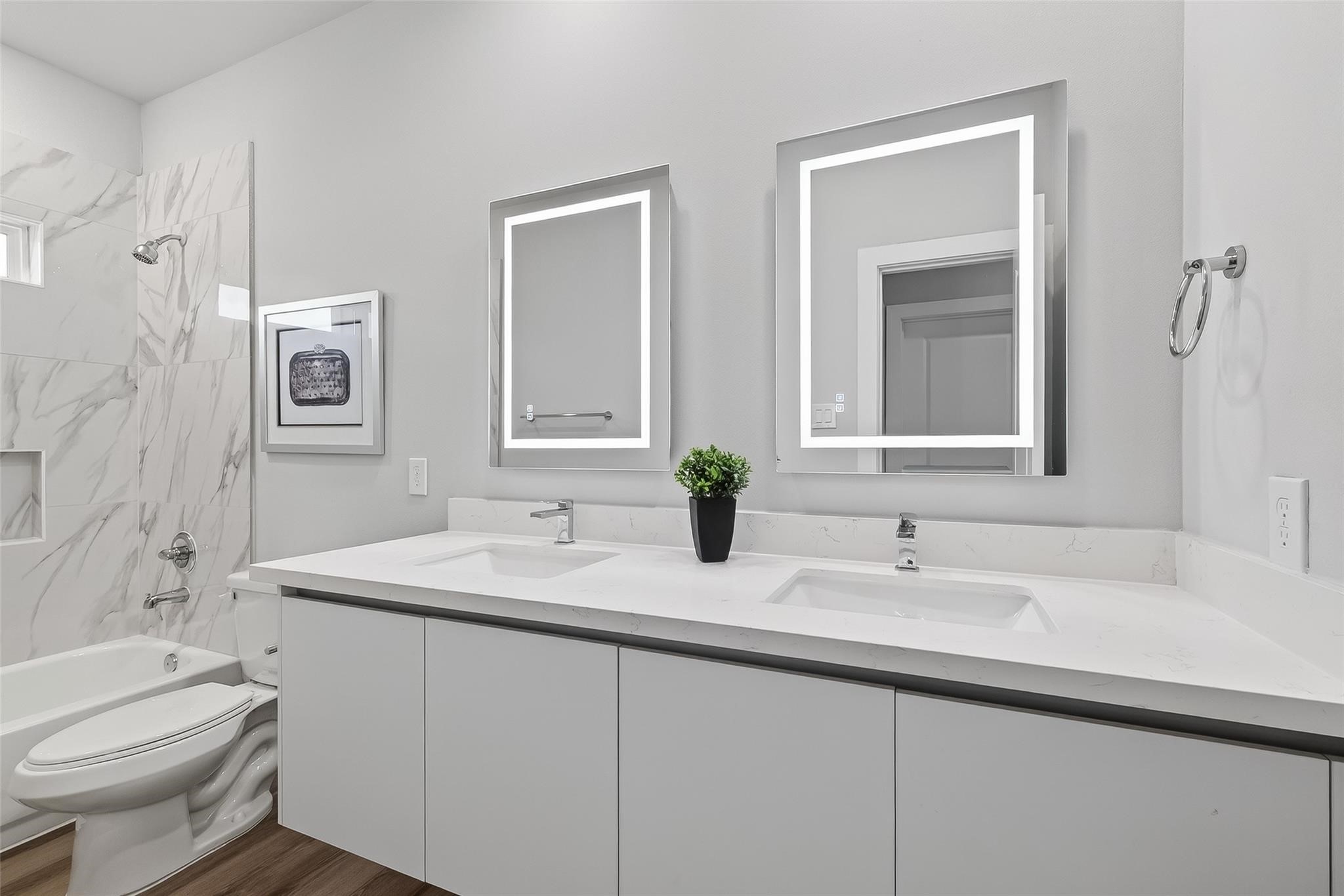 6702 Metro Boulevard, Unit 2 Houston, TX 77083 - Photo 31 of 39 a bathroom with a sink toilet and mirror