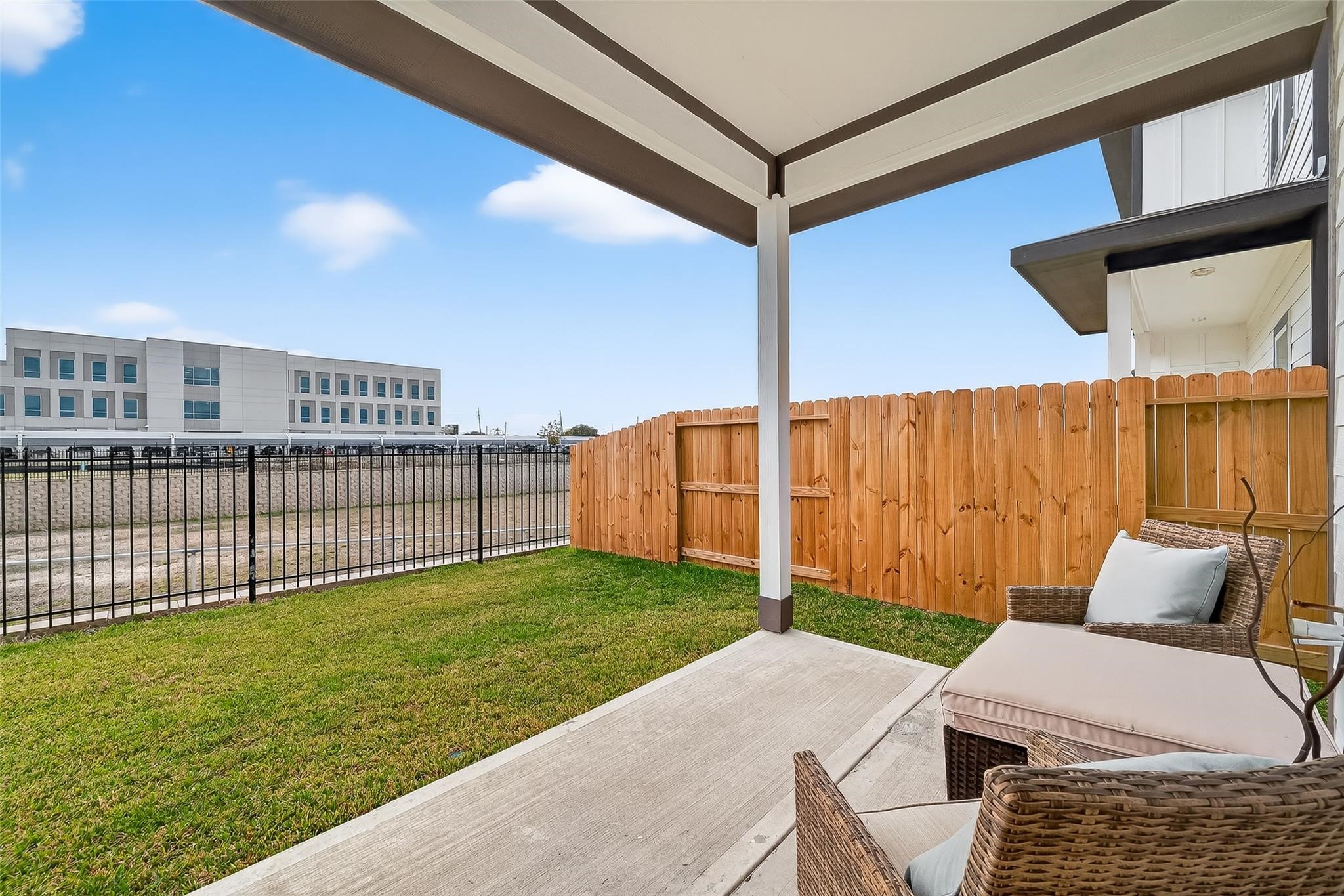 6702 Metro Boulevard, Unit 2 Houston, TX 77083 - Photo 33 of 39 a backyard of a house with table and chairs