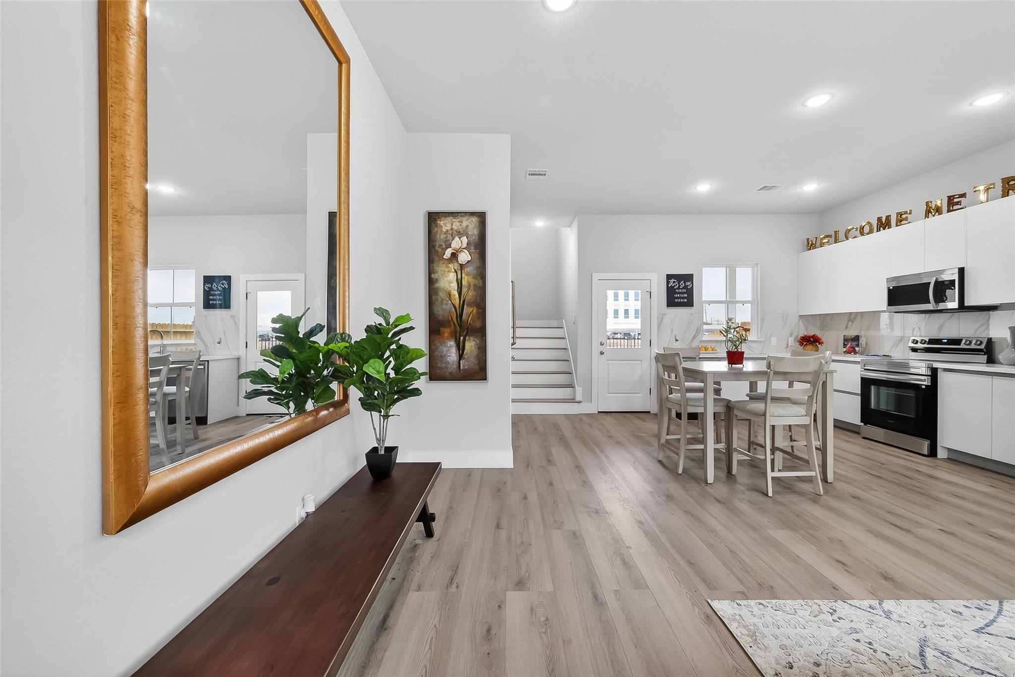 6702 Metro Boulevard, Unit 2 Houston, TX 77083 - Photo 6 of 39 a living room with furniture and a wooden floor