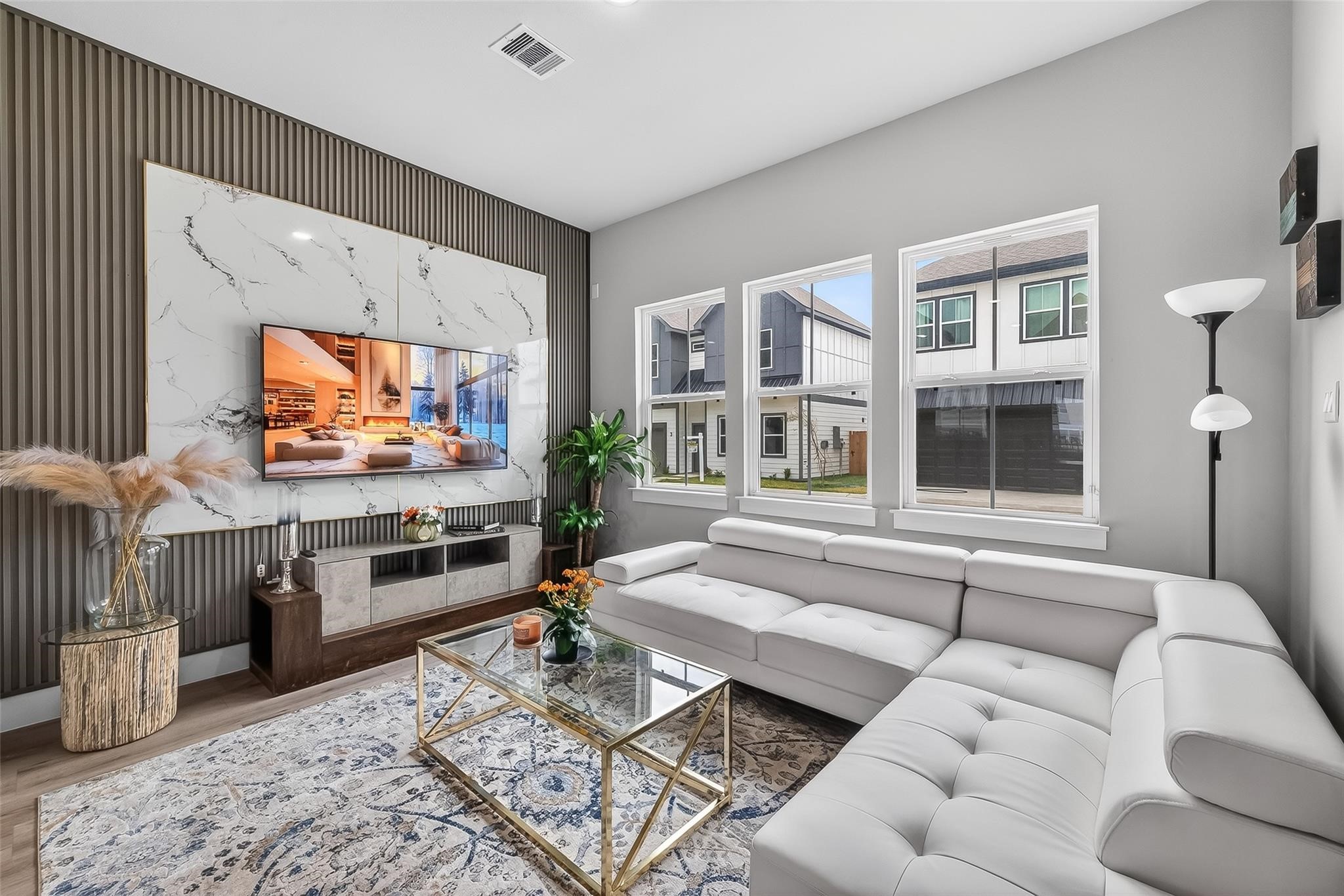 6702 Metro Boulevard, Unit 2 Houston, TX 77083 - Photo 7 of 39 a living room with furniture and a flat screen tv