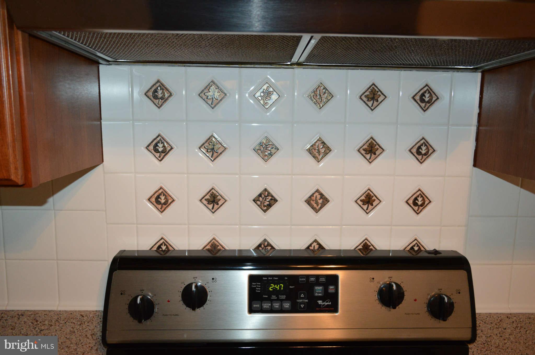 319 Timber Grove Road Owings Mills, MD 21117 - Photo 6 of 22 Beautiful back splash with design at stove