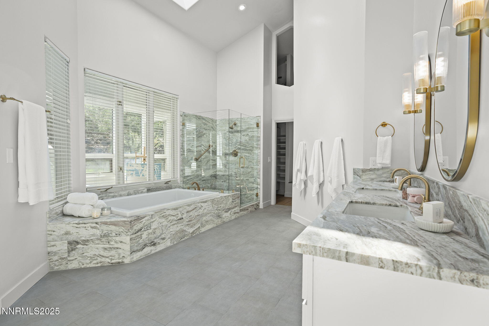 4292 Caughlin Parkway Reno, NV 89519 - Photo 18 of 37 a spacious bathroom with a double vanity sink and a bathtub