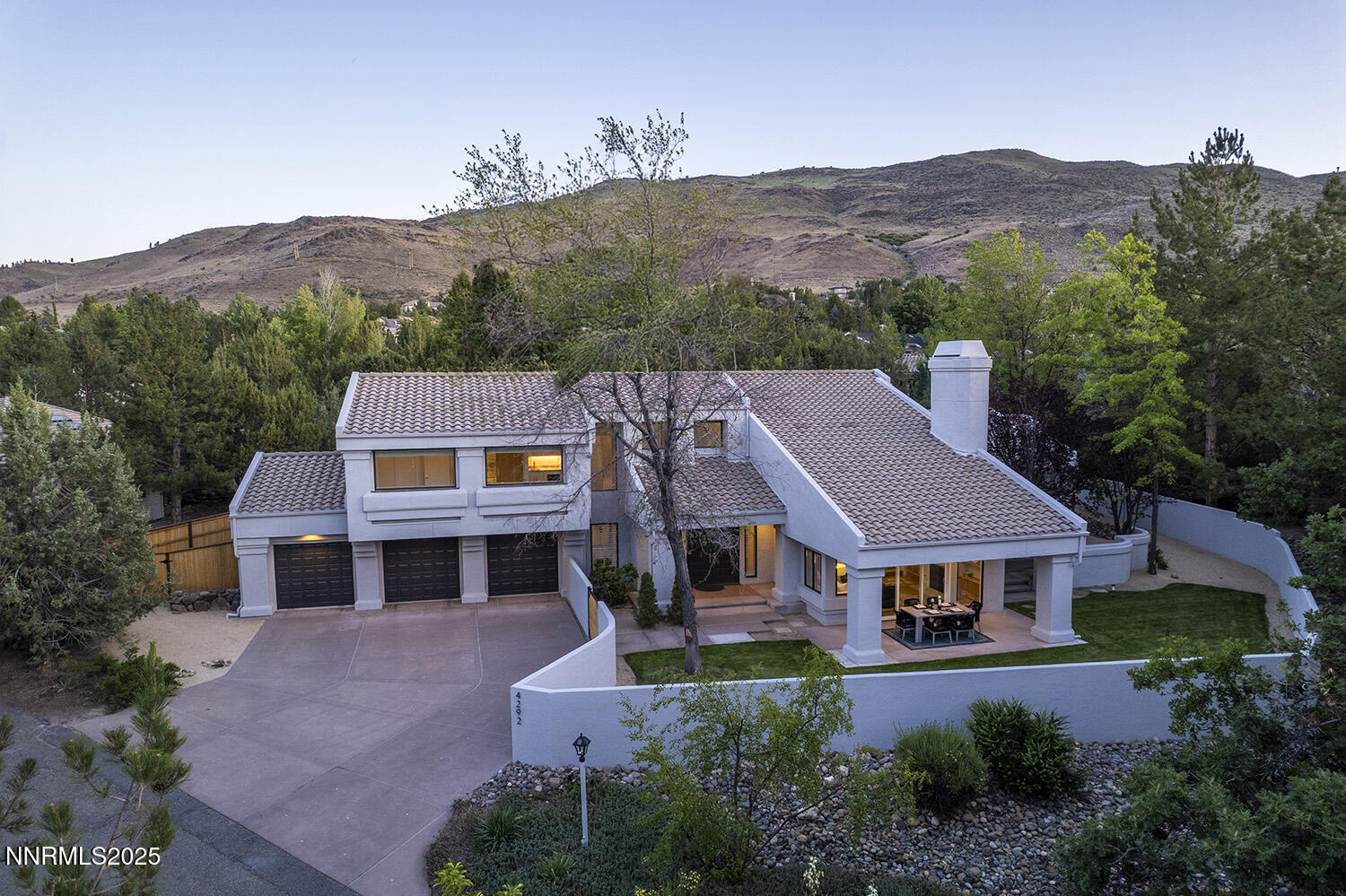4292 Caughlin Parkway Reno, NV 89519 - Photo 35 of 37 an aerial view of a house with a mountain in the background