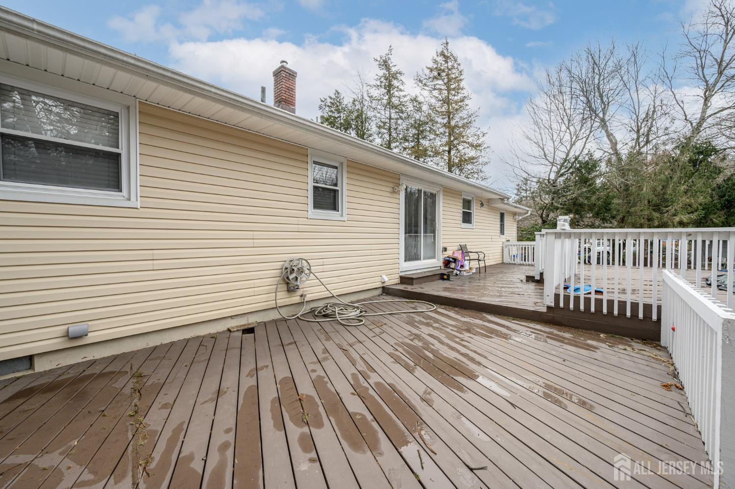 384 Cook Road Jackson, NJ 08527 - Photo 26 of 31 a view of a deck with chairs and wooden floor