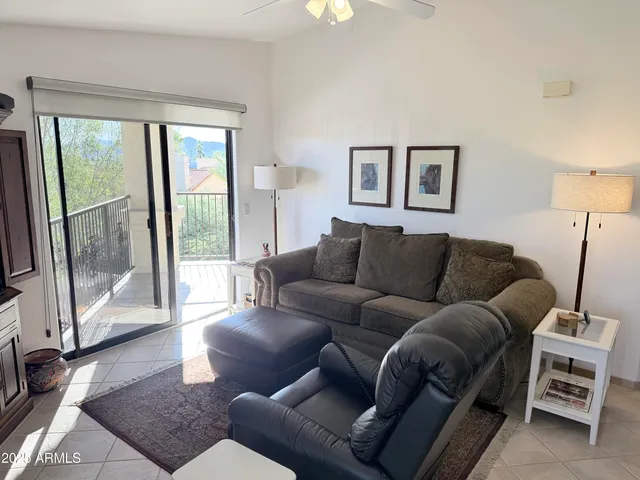 a living room with a couch and a large window
