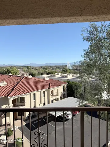 a balcony with a city view