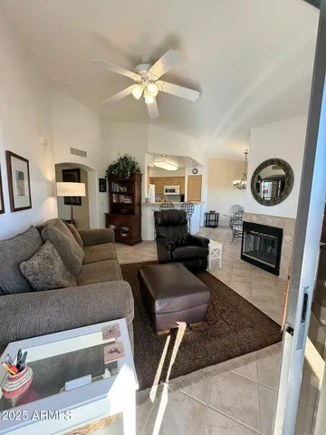 a living room with furniture and a fireplace