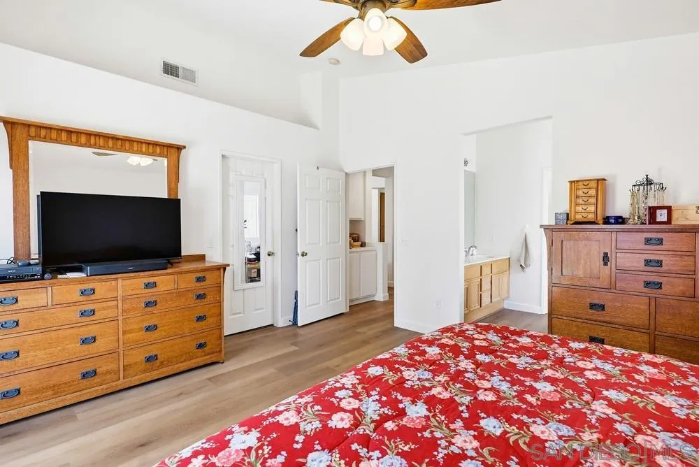 2501 Columbine Road Alpine, CA 91901 - Photo 16 of 44 a bedroom with a bed and flat screen tv