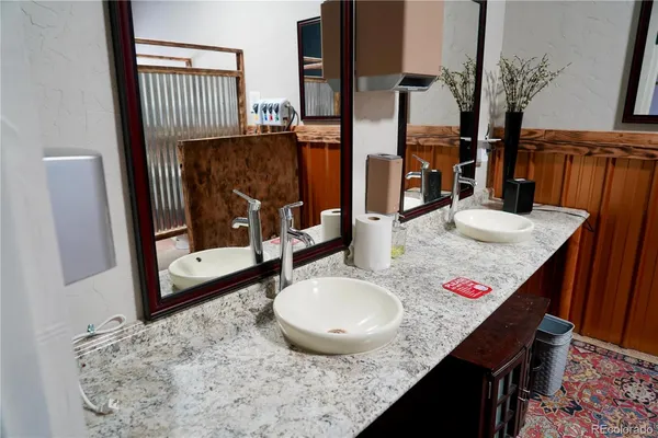 a view of a balcony with mountain view and wooden floor